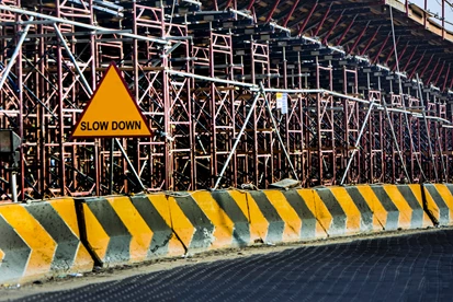 A road with a slow down sign.