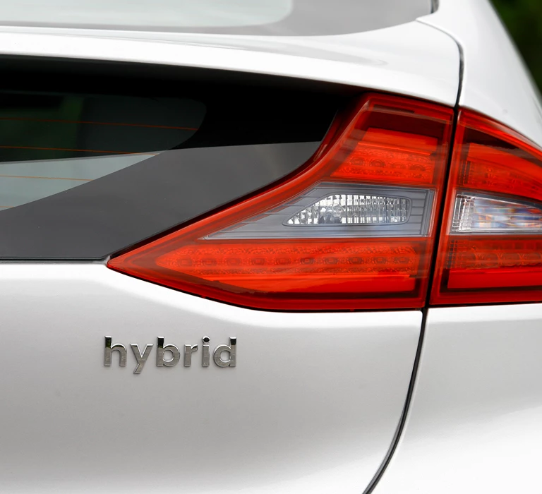 The back of a silver hybrid car - Reasons To Lease A Hybrid Vehicle