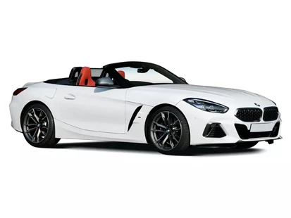 A pristine white BMW Z4 parked on a winding mountain road. The car's sleek body reflects the sunlight, emphasizing its aerodynamic design and elegant curves. The convertible top is down, allowing a glimpse of the interior cabin with its luxurious leather seats and modern dashboard. The Z4's sporty silhouette and dynamic lines evoke a sense of excitement and driving pleasure