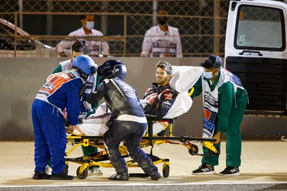 Romain is taken to an ambulance and then is airlifted to the nearby military hospital.