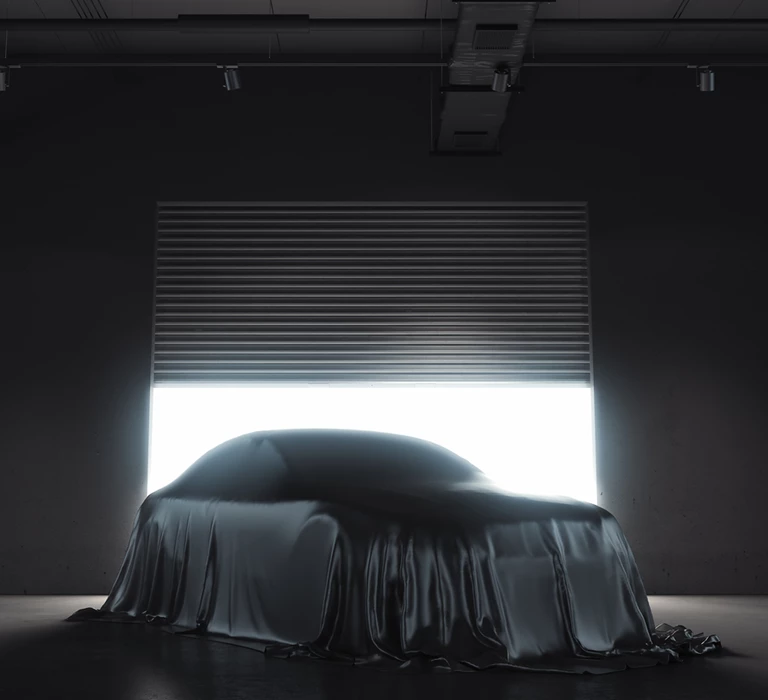 car hidden under black cloth